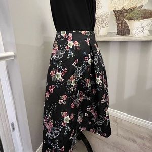 Black floral A-line skirt with pink and green flowers. Size 6